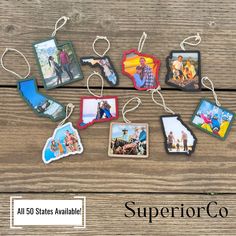 some pictures hanging from strings on a wooden table with the words, all 30 states available