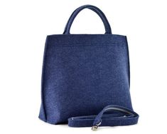 This is a minimalist navy blue felt bag with zipper closure . It is made out of strong, technical felt, 4mm thick. Medium size work handbag with short handles and a long strap - can be used as a crossbody purse. The bag looks really nice. It is a great work bag. Measurements: height 27 cm/ 10.5 inch depth max 15 cm/ 6 inch maximum width 31 cm/ 12 inch The bag has a zip closure. It was made taking care of each small detail. The bag stands on it's own. - 1 zippered pocket inside, - 1 mobile pocket Bag Minimalist, Work Handbag, Gray Handbags, Bag Measurements, Bag With Zipper, Bag Stand, Felt Bag, Work Bag, Small Detail