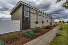 a mobile home sits in the front yard