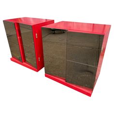 two red mirrored cabinets sitting next to each other