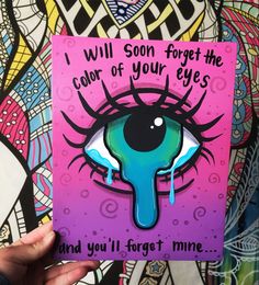 someone is holding up a card with an eye painted on it and the words i will soon forget the color of your eyes