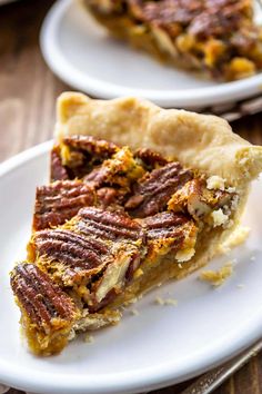 a piece of pecan pie on a white plate