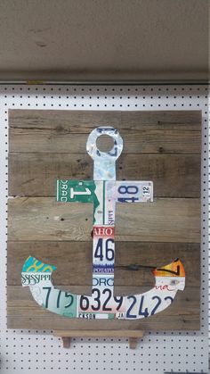 an anchor made out of license plates on a wall