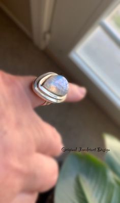 "Artisan Moonstone Ring. Unique Modern Moonstone Ring. Promise Ring. Me Gift🎁 Statement Moonstone Ring. Rainbow Moonstone Ring. Beautiful Unique Moonstone Ring bezel set on a hand forged heavier solid silver double size 7 1/2 band. Perfect Birthday, Anniversary, or Me Gift. Comes in a Jewelriart Gift box🎁 Thanks for Supporting Handcrafted❤️❤️ Healing Properties of Moonstone. A stone for \"new beginnings\", Moonstone is a stone of inner growth and strength. It soothes emotional instability and Handmade Oval Moonstone Ring In Modern Style, Handmade Modern Oval Moonstone Ring, Modern Handmade Oval Moonstone Ring, Unique Large Moonstone Ring, Handmade Moonstone Teardrop Ring, Unique Moonstone Ring With Large Stone, Unique Open Moonstone Ring, Modern Handmade Moonstone Ring For Gift, Handmade Modern Moonstone Ring For Anniversary