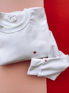 Wear your heart on your sleeve (literally)! 🤣🥰 Our cute, soft and simple white love heart oversized sweatshirt in sizes S to XL (women's oversized sizing - size guide as shown) (sizes 6-16)  ♥️ Hand embroidered tiny love heart on the right hand side with a little '♥️' stitched on the sleeve (just for that extra bit of love)  Pssst.. added bonus they are super soft which makes for the perfect outfit for lounging.. who doesn't want to look super cute while lounging ✌🏼 All our orders are carefully packaged by ourselves in recyclable boxes, tissue paper and thank you cards. They are then sealed with a biodegradable Kind Regards sticker - this means all your packaging can be popped in one bin! So easy and helps the planet 🌱 *If you have any questions please don't hesitate to drop us a messa Oversized White Sweater, White Oversized Sweater, Cute Love Heart, Heart Clothes, Embroidery Hoodie, White Love, Heart Hoodie, Heart Sweatshirt, Embroidered Heart