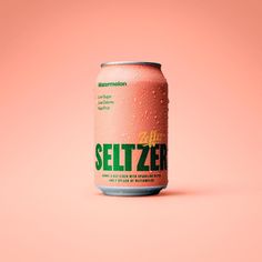 a can of seltzer on a pink background