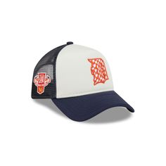 a white and blue hat with an orange patch on the front