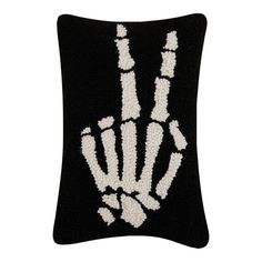 a black and white pillow with a hand print on it