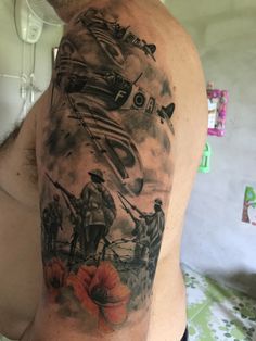 a man's arm with an airplane and soldiers tattoo on the left side of his body