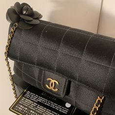 Chanel Black Satin Quilted Camellia Mini Crossbody Y2k Vegan 3- Way Bag Black Leather Camellia Flower Gold Hardware Gold Cc Snap Front Closure Goldtone Chain Strap Hardware Intertwined With Black Leather Can Be Carried Three Ways! Single Strap Long As Crossbody 25” L Strap Doubled Over Shoulder/ Arm 11.0” L Strap Strap Tucked Inside The Bag As Clutch Roomy Black Satin And Black Cc Logo Lining Open Compartment Interior Fits My Iphone Perfectly Made In Italy Smoke Free / Pet Free Home Comes Comple Classic Black Bags As Fashion Accessory, Classic Black Bag As Fashion Accessory, Designer Black Bag With Chain, Classic Black Bags, Chanel Vanity Case, Iconic Y2k, Chanel Le Boy, Satin Quilt, Chanel Clutch