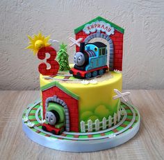 a thomas the train birthday cake on a table