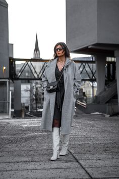 Whoever claimed that a knit wrap dress must be dull clearly hasn't explored its full potential! | How To Wear A Knit Wrap Dress: Wrap It Up & Unleash Your Style | Grey Knit Wrap Dress Winter Outfits, White Boots, Black Tights