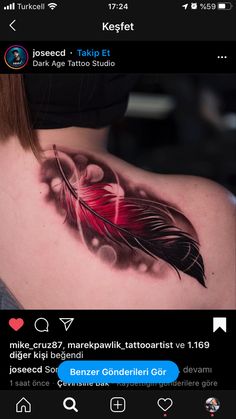 the back of a woman's shoulder with a tattoo design on her left side