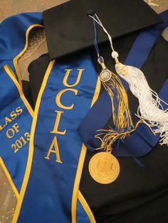 graduation caps and tassels are laid out on the floor