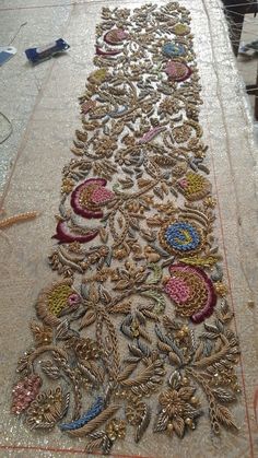 an embroidered table runner is being worked on