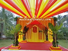 a decorated stage with red, yellow and orange decorations