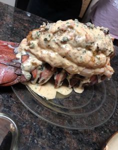 there is a lobster with sauce on it