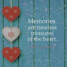 two hearts hanging from a string with the words memories are times less treasures of the heart