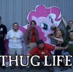 a group of people standing next to each other in front of a building with the words chug life on it