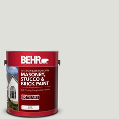 a red paint can with the words behrr on it and an image of a house