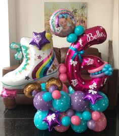 balloons and decorations are arranged on a couch