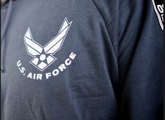 the u s air force logo is shown on a man's shirt