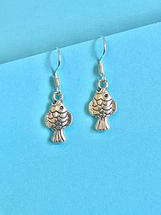 Fish mini dangle earrings for those fish lovers out there... beautiful and dainty.  The hook is made of plated sterling silver to protect your ears and the fish is made from Tibetan silver.  They come well presented and wonderful for a present for a friend, family or your loved one. I offer free UK postage and will despatch same day as purchase.  Thank you for taking the time to look at my earrings and please visit my shop for more original designs. Bespokedanglers.  For Fun, Funky, Quirky and o Silver Fish-shaped Earrings With Ear Wire, Silver Fish-shaped Earrings With Fish Hooks, Present For Her, Le Crochet, Presents For Her, Delicate Earrings, The Fish, Carp, Hippie Boho