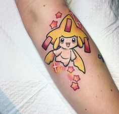 a person with a pokemon tattoo on their arm and the word pikachu written in it