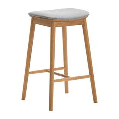 a wooden stool with a grey seat pad on the bottom and backrest, in front of a white background