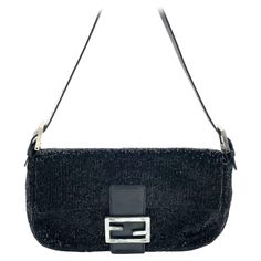 Fendi Baguette Vintage Black Glitter Beads Shoulder Bag Discover the Fendi Baguette Vintage Black Glitter Beads - a masterfully crafted, iconic design enhanced with shimmering beads. This exquisite piece of art is versatile and can elevate any outfit, making it a timeless addition to your wardrobe. CONDITION: VERY GOOD This vintage preloved Fendi baguette is in very good condition with minimal signs of wear. Most beads are in tact, and there are a few scratches on the leather of the flap. DETAIL Fendi Baguette Vintage, Fendi Vintage, Outfit Making, Iconic Design, Black Hardware, Black Glitter, Material Exterior, Fendi Baguette, Fashion Handbags