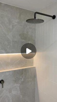 a shower head with the light turned on and water running down it's side