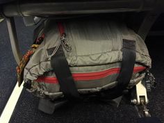 the back end of an airplane with luggage on it's seat belt and wheels