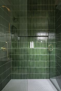 Green tile shower in vertical tile design. Brass shower fixtures and white hex shower floor. Built-in shower niche. Vertical Shower Tile, Emerald Green Kitchen, Max Humphrey, Oregon Beach House, Oasis Bathroom, Small Bathroom Renos, Country Living Fair, Mobile Coffee Shop, Cabin Vibes