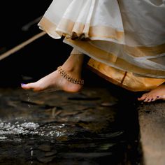 a woman's feet and ankles are covered in water