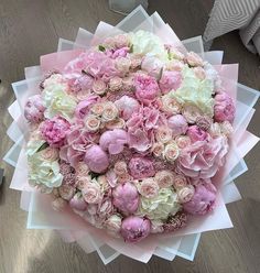 a large bouquet of pink and white flowers