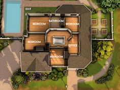 an aerial view of a house with several rooms and two swimming pools in the yard