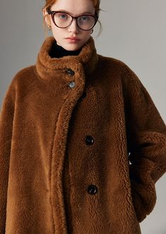 Indulge in luxurious warmth and style with our Hazel Wool Fur Teddy Coat. This single-breasted piece features rich, brown teddy wool and white sheep shearling for a cozy and chic winter look. The oversized fit adds a touch of elegance, perfect for the fashion-forward sophisticate. 100% wool sheep fur Oversize fit Single breasted closure Two side pockets Drop shoulders Dry clean Item #312293 Women's winter wool coat/jacket SIZE INFO XS=US2=UK6=EU32 S=US4-6=UK8-10=EU34-36 M=US8-10=UK12-14=EU38-40 Brown Fur Coat With Buttons For Fall, Brown Fur Coat With Button Closure For Fall, Brown Winter Fur Coat With Button Closure, Cozy Brown Long Sleeve Fur Coat, Brown Shearling Fur Coat, Brown Shearling Fur Coat With Long Sleeves, Brown Shearling Fur Coat For Work, Oversized Brown Fur Coat With Long Sleeves, Brown Cozy Fur Coat With Faux Fur Lining