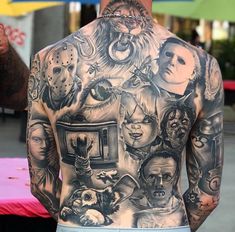 the back of a man with many tattoos on his body