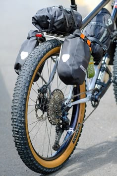 the bike is parked on the side of the road with its front wheel still attached