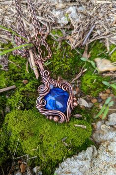 This pendant is a Sodalite cabochon wrapped in oxidized copper wire, with a small accenting moonstone. Wire Wrapped Sodalite Jewelry As Gift, Wire Wrap Necklace, Wire Wrapped Jewelry Tutorials, Wrap Necklace, Oxidized Copper, Wire Wrapped Necklace, Wire Wrapped Pendant, Jewelry Tutorials, Wire Wrap