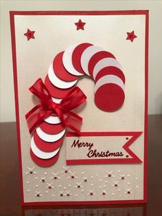 a red and white christmas card on a table