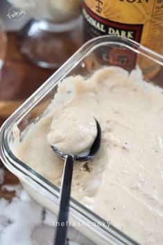 a spoon is in a bowl with some food