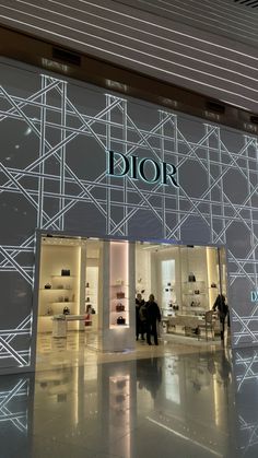 the entrance to dior's new store is lit up