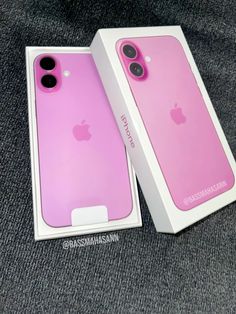 two pink iphone cases sitting in a box on a gray surface with the packaging open