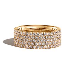 a gold ring with rows of diamonds on it