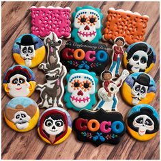 decorated sugar cookies with the theme of coco and day of the dead