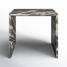 an artistically designed marbled side table on a white background with no people around it