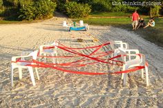 there are many chairs that have been placed on the beach for people to sit down