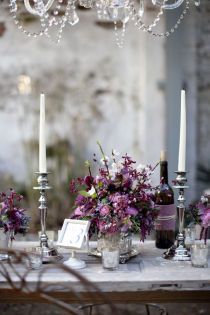 the table is set with candles and flowers