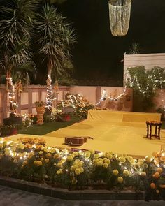 an outdoor patio decorated with lights and flowers